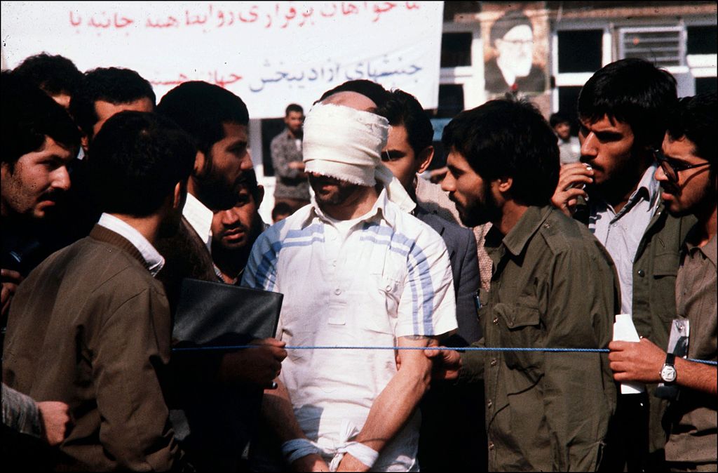 An American hostage is taken in Tehran, Iran in 1979