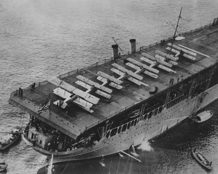 Aerial view of the USS Langley (CV-1) with warplanes on her deck