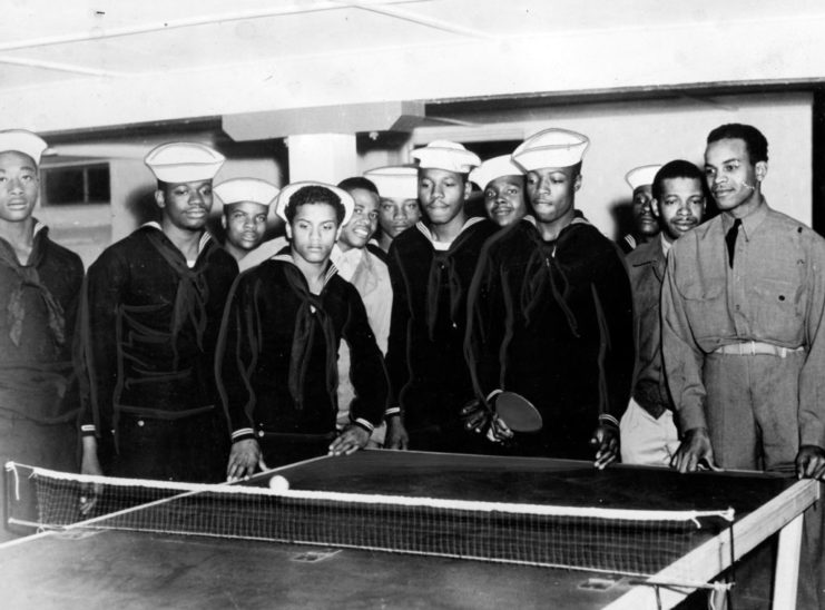 Soldiers standing around a ping pong table