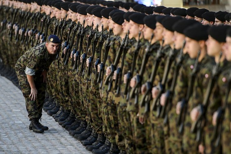 An officer inspects a large group of Swiss soldiers 