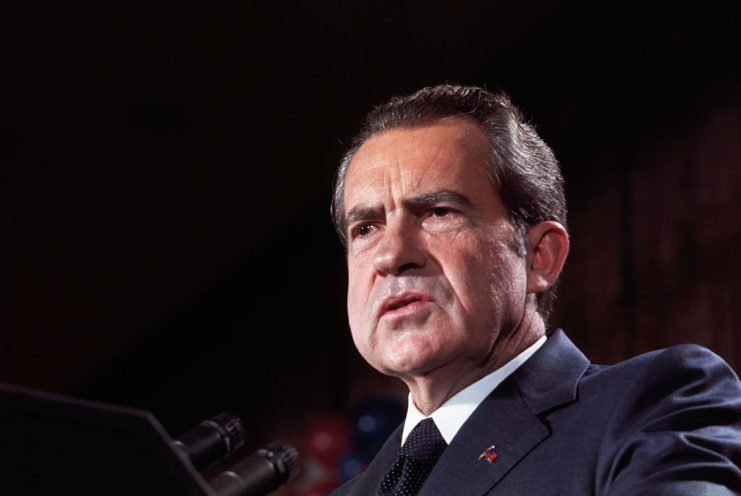 Richard Nixon speaking at a podium