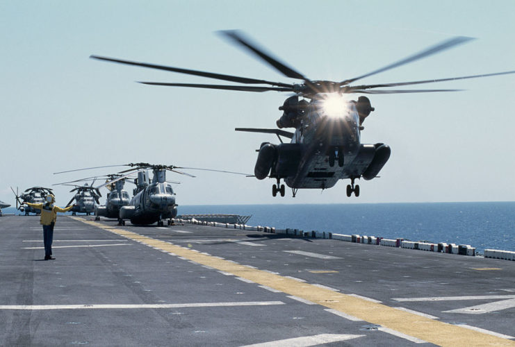 CH-53 helicopters take off from a landing base in Bosnia
