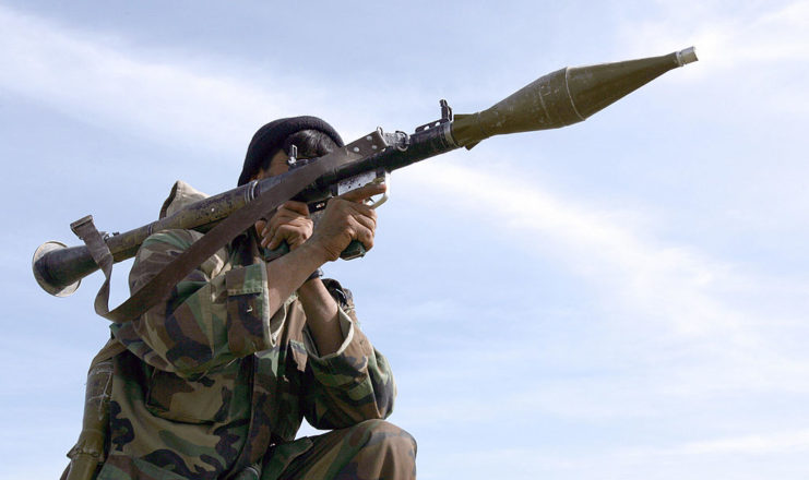 Soldier shouldering a rocket propelled grenade launcher