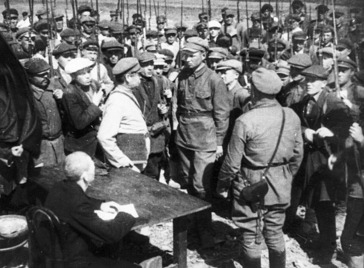 Russian soldiers standing with civilians