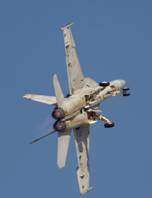 Boeing F/A-18F Super Hornet performing an maneuver in flight