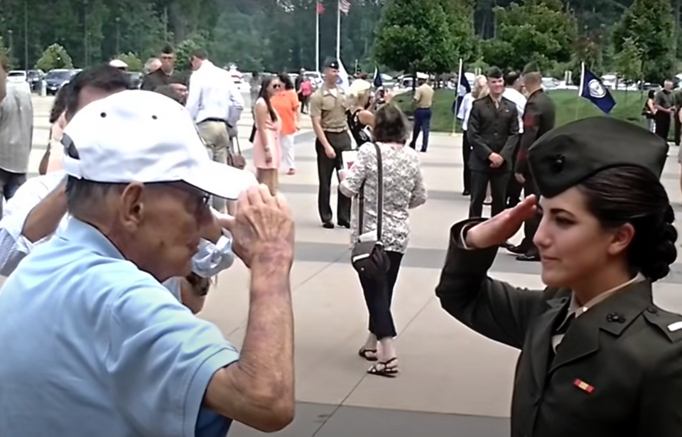 Staff Sgt. James Williams saluting 2nd Lt. Charlotte Williams