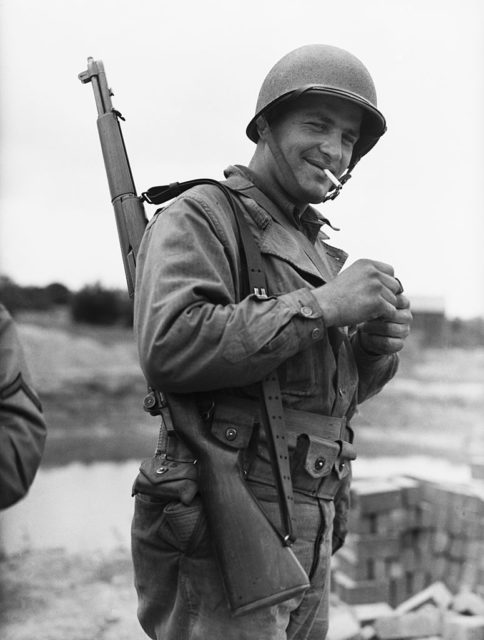 Pvt. John Ziaja smoking a cigarette while in uniform