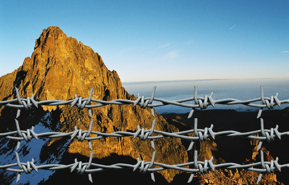 Mount Kenya with barbed wire in front.