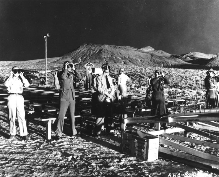 Observers standing together in the Nevada desert