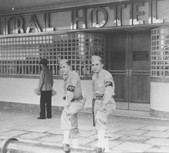 Two American soldiers standing outside a Brisbane hotel