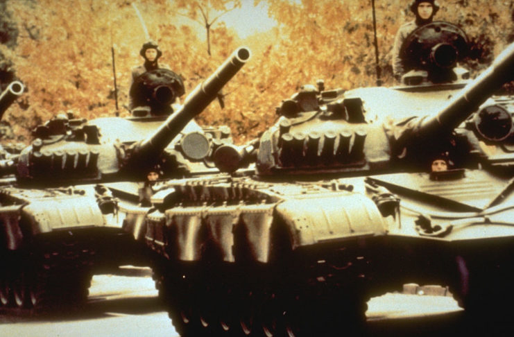 Two T-72 tanks driving in a line