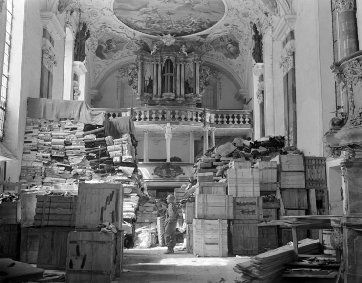Wooden crates staked within a church