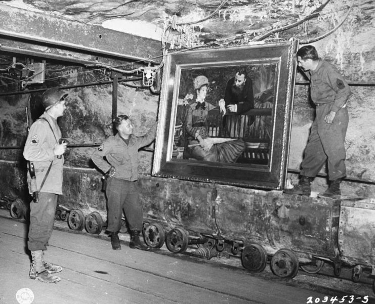 American soldiers holding Edouard Manet's 'Wintergarden'