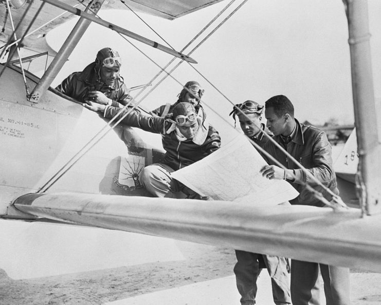 Tuskegee Airmen reading a map
