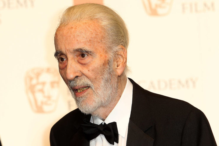 Christopher Lee wearing a suit and bowtie
