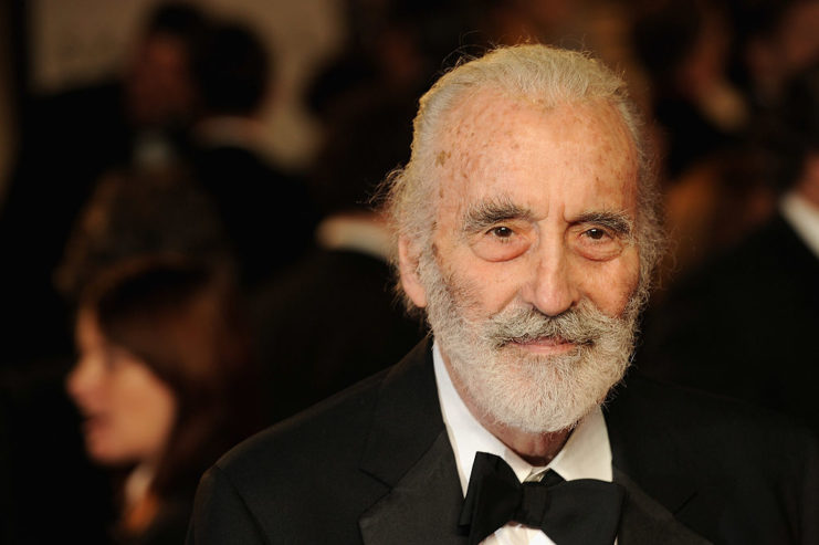 Christopher Lee dressed in a suit and bowtie