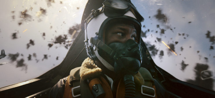Jesse Brown (Jonathan Majors) flies his fighter plane in the film "Devotion".