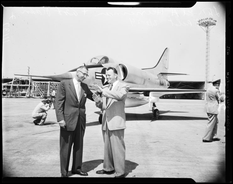 Ed Heinemann and Lt. Cmdr. Jerry Haggerty standing in front of a Douglas A-4 Skyhawk