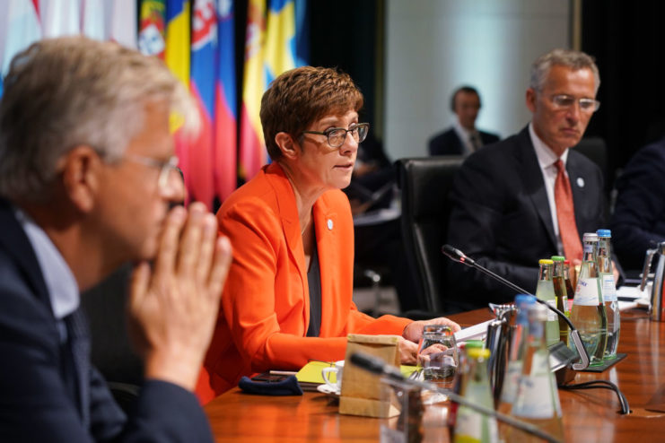 Annegret-Kramp Karrenbauer sitting with other political figures