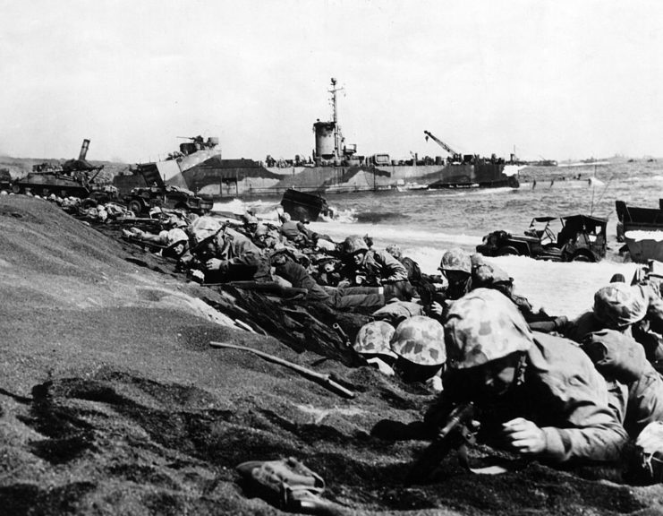 US Marines laying in the sand