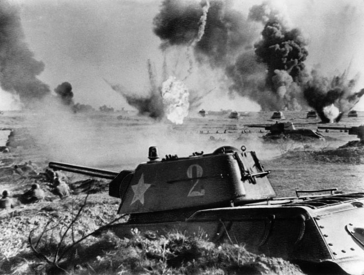 Tank positioned with explosions in the background