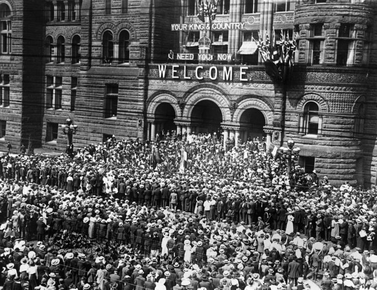 Large crowd standing outside of Toronto City Hall