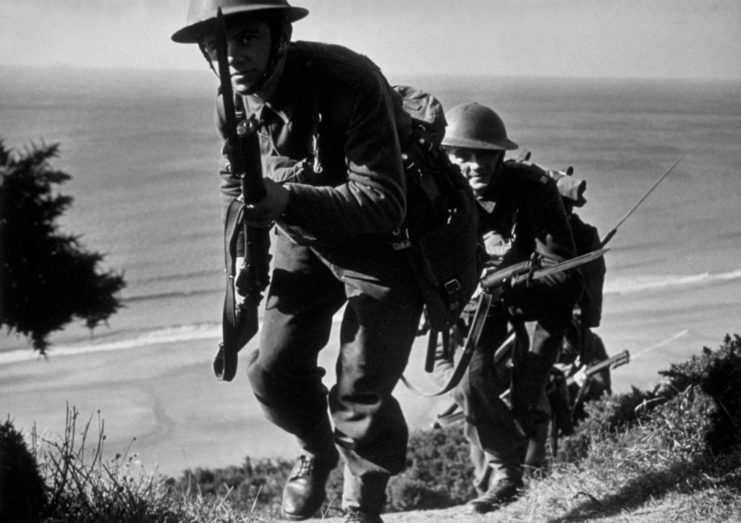 Marines running up a hill