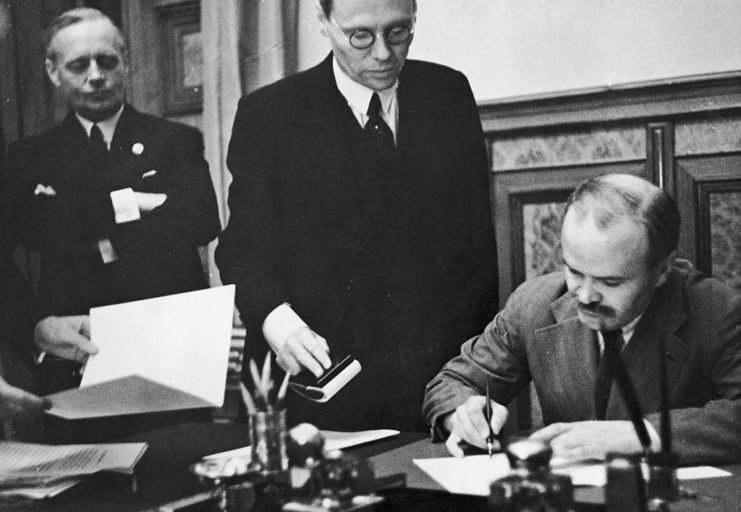 Officials signing a document