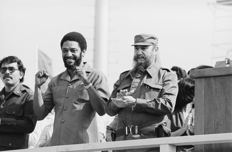 Maurice Bishop standing beside Fidel Castro