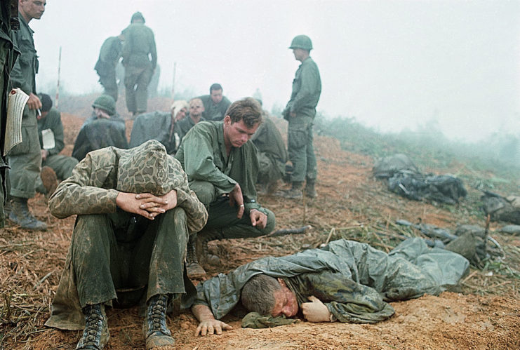 Wounded soldiers gathered together on a foggy hill