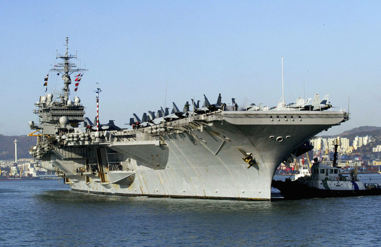 USS Kitty Hawk (CV-63) anchored in the water