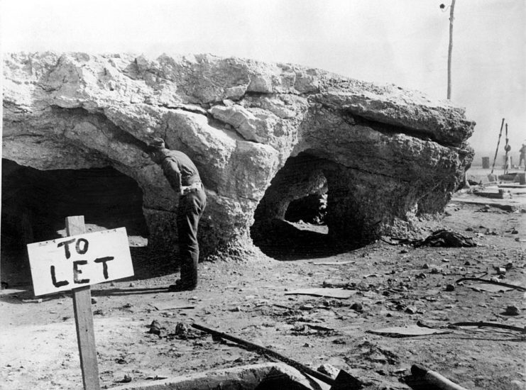 Caves with a "To Let" sign in front of their entrances