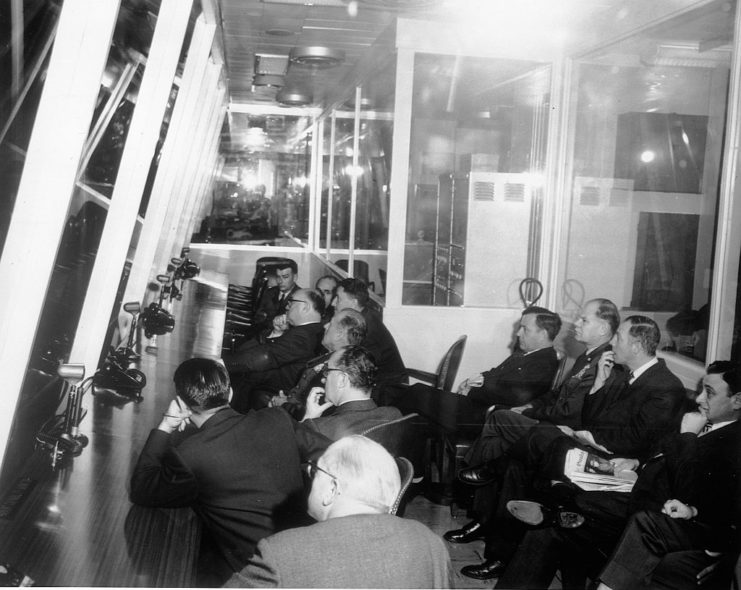 Officials sitting together in the Headquarters Strategic Air Command control room