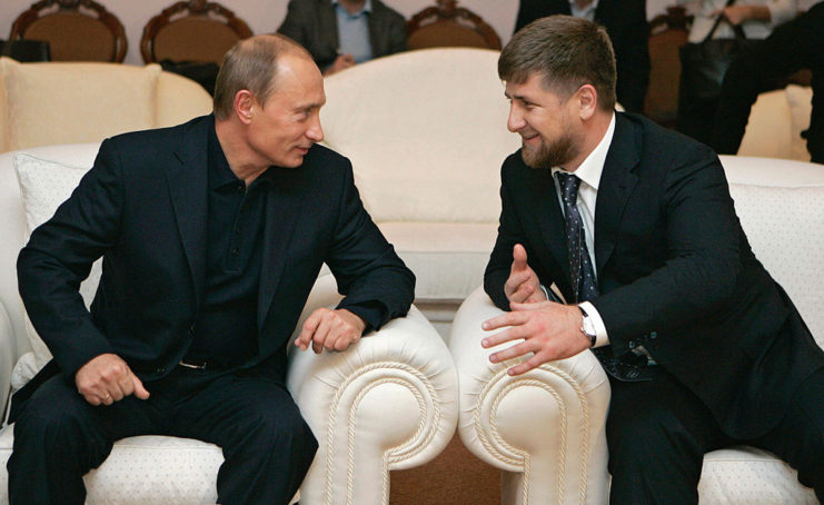 Vladimir Putin sitting with Ramzan Kadyrov