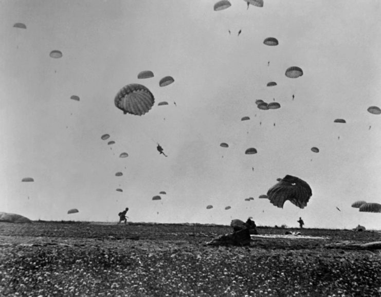 Allied paratroopers landing on a beach