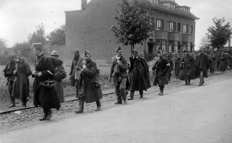 Soldiers walking along a road