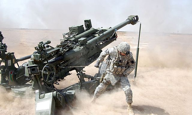 US soldier firing an M777A2 howitzer