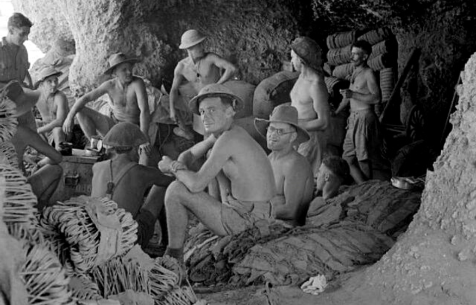 Australian soldiers sheltering in a cave