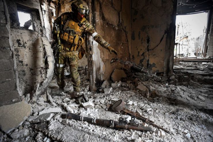 Russian soldiers dropping a gun