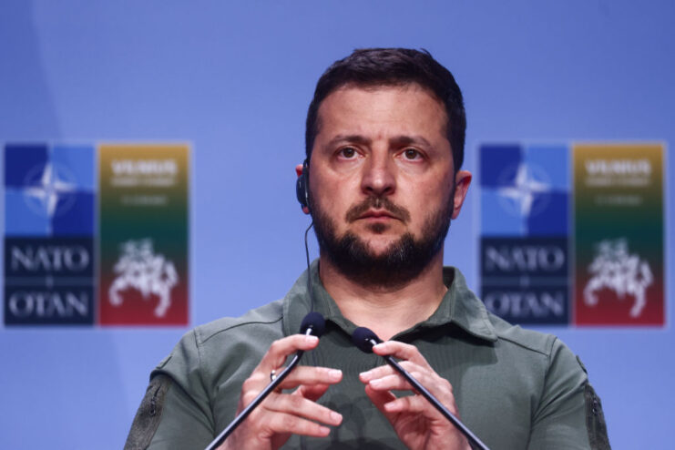 Volodymyr Zelenskyy speaking at a podium