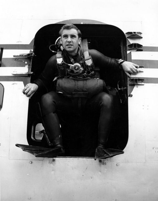 William H. Pitsenbarger standing in the door of an aircraft