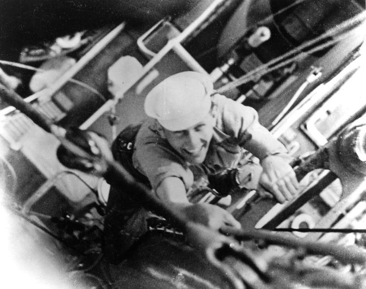 Douglas Munro climbing a ladder