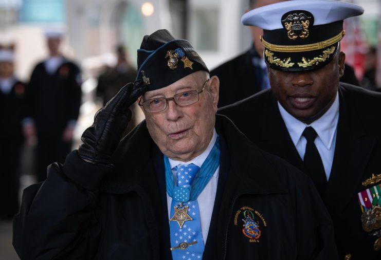 Hershel W. "Woody" Williams saluting while wearing his Medal of Honor