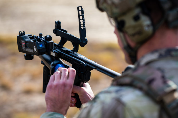 US Army soldier rearming an M320 grenade launcher