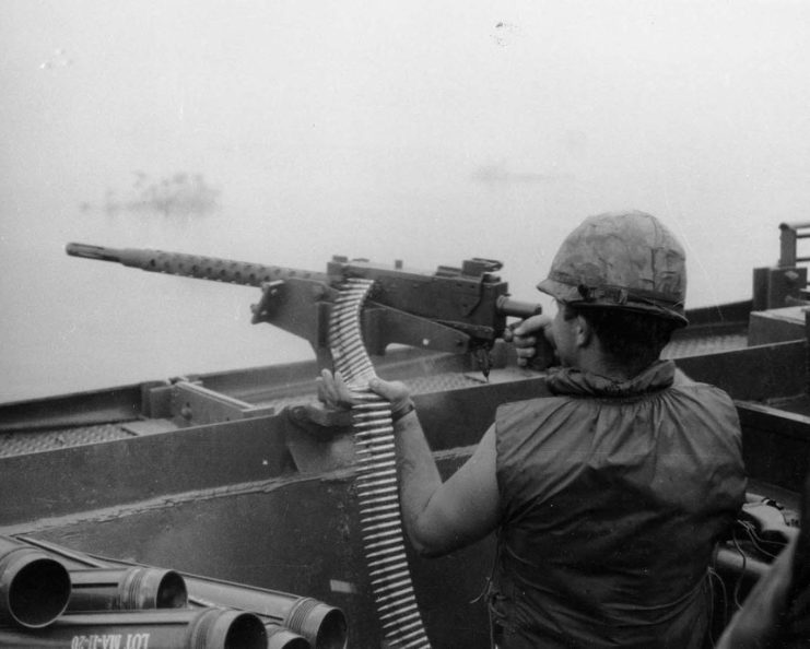 US Navy machine gunner firing an M1919 Browning