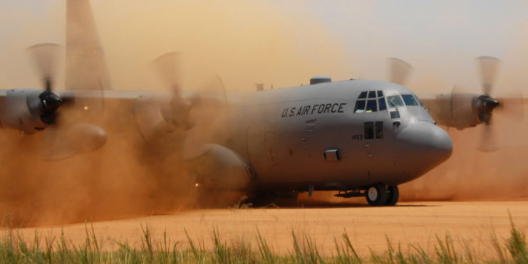 Lockheed C-130 Hercules surrounded by dust