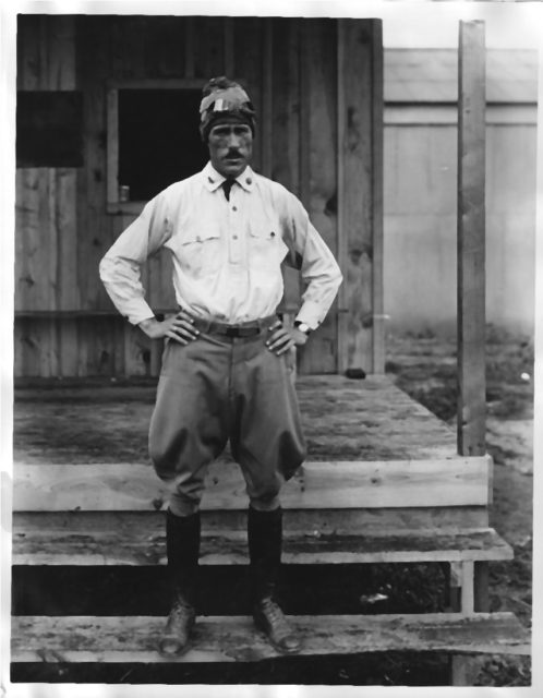 Clarence L. Tinker standing with his hands on his hips