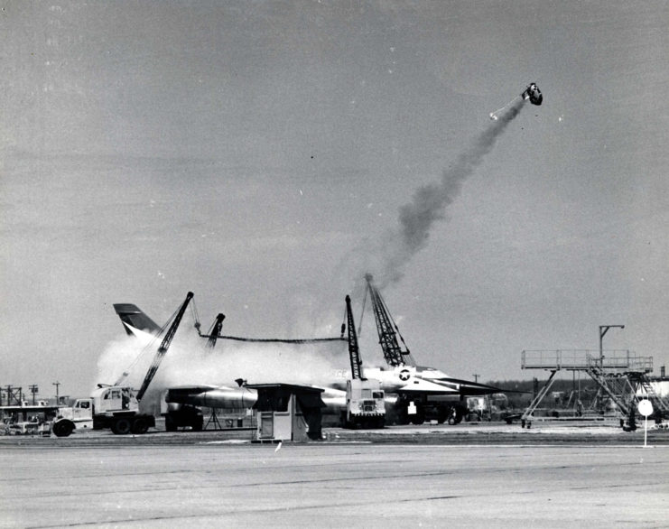 Ejection capsule in the air above a Convair B-58 Hustler