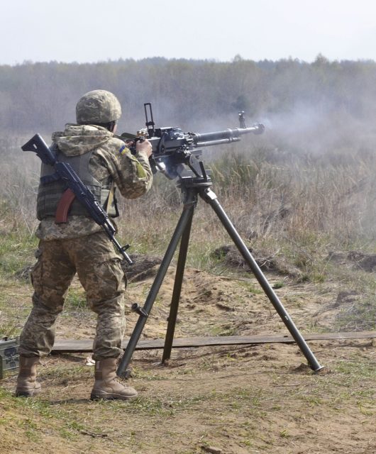 Ukrainian soldier firing a DShKM heavy machine gun
