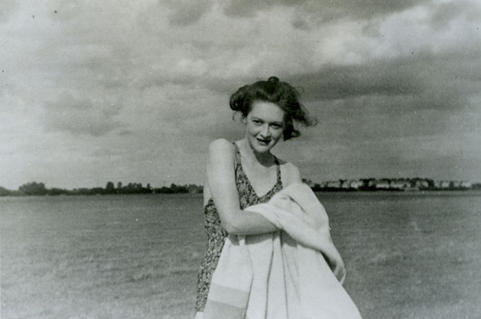 Female MI5 agent wearing a swimsuit while at the beach